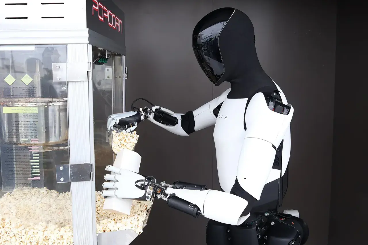 Ein humanoider Roboter füllt Popcorn in eine Tüte. Die Robotik-Aktie könnte bald solche Helfer einsetzen.